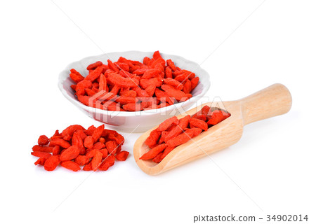 dried goji berries in wooden scoop and white bowl 34902014