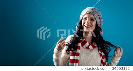 Happy young woman in winter clothes  34903352