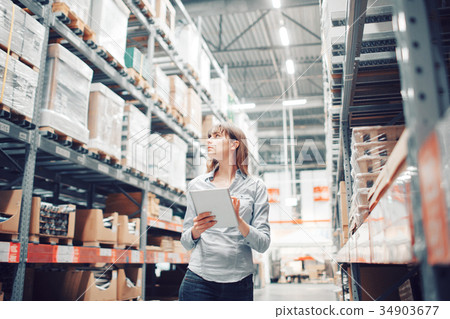 stock taking. beautiful young woman worker of 34903677