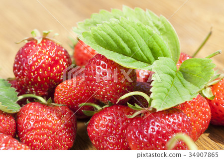 fresh strawberries on table 34907865