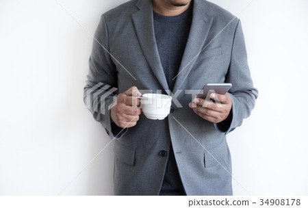 man use phone happy and smile with coffee and man use phone happy and smile with coffee and 34908178