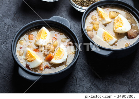 The sour soup made of rye flour with eggs 34908805