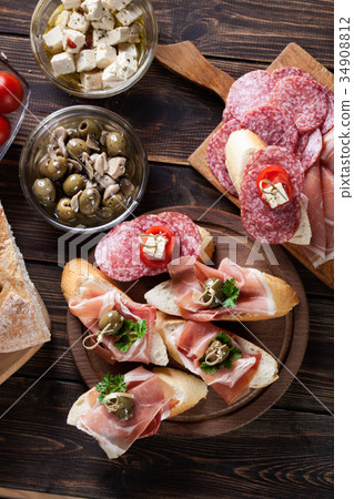 Spanish tapas with slices jamon serrano Spanish tapas with slices jamon serrano 34908812