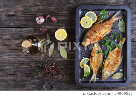 roast bream fish on baking sheet roast bream fish on baking sheet 34909533