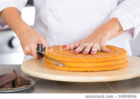Pastry chef in the kitchen Pastry chef in the kitchen 34909694