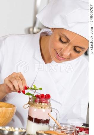 Cook making a dessert 34909707