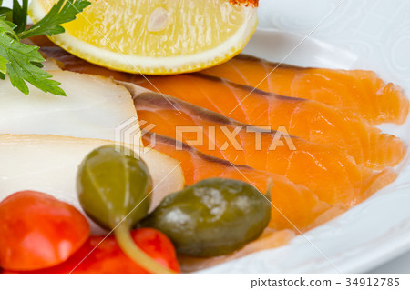 Photo of salmon snacks with lemon Photo of salmon snacks with lemon 34912785