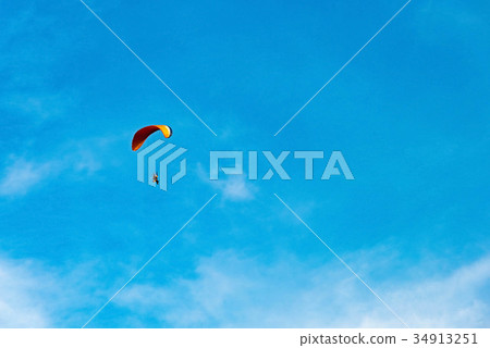 man ride Paramotor flying in the sky man ride Paramotor flying in the sky 34913251