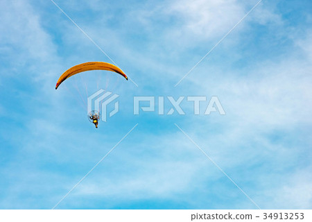man ride Paramotor flying in the sky man ride Paramotor flying in the sky 34913253