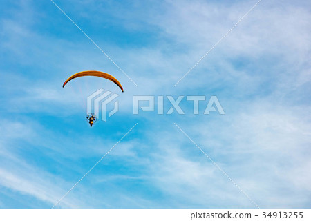 man ride Paramotor flying in the sky man ride Paramotor flying in the sky 34913255