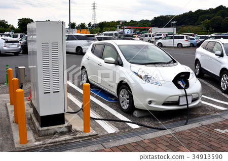 Electric car charging in service area Electric car charging in service area 34913590