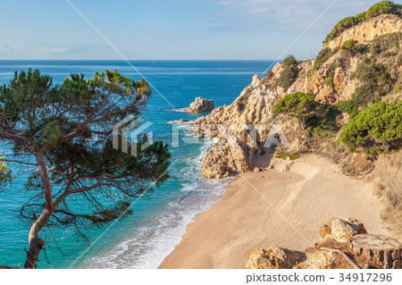 Idyllic Meditteranean beach near Calella Idyllic Meditteranean beach near Calella 34917296