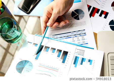Businessman working and analyzing financial figure Businessman working and analyzing financial figure 34918013