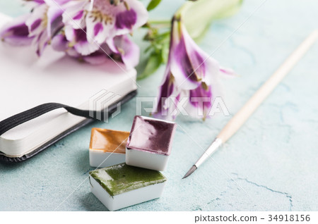 Paint brushe, purple, yellow and green paint 34918156