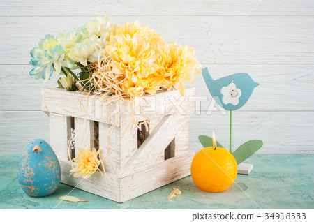Blue and yellow chrysanthemum in white wooden box 34918333