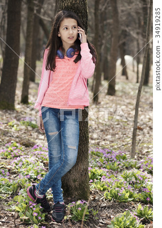 Girl Talking Phone Park Spring Primroses Girl Talking Phone Park Spring Primroses 34919285
