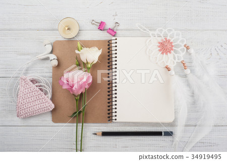 Blank notebook, pink crochet holdel, earphones 34919495