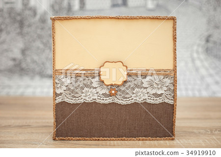 Decorated wedding guest book on the wooden table Decorated wedding guest book on the wooden table 34919910