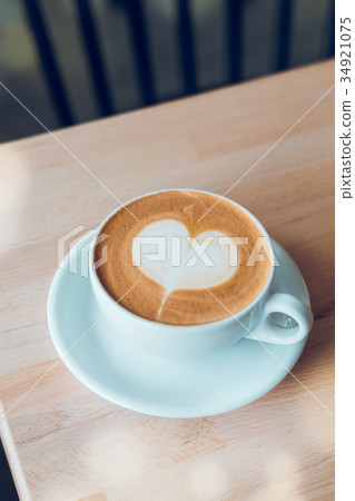 Cappuccino white cup with heart shaped latte art 34921075