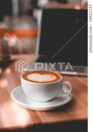 Coffee with laptop on wooden table 34921137