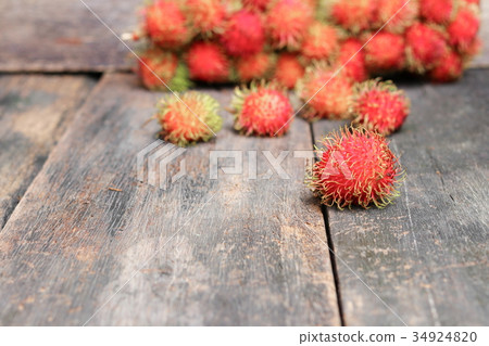 rambutan sweet fruit fresh on wood background rambutan sweet fruit fresh on wood background 34924820