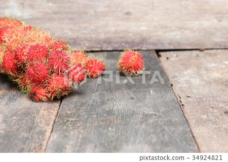 rambutan sweet fruit fresh on wood background rambutan sweet fruit fresh on wood background 34924821