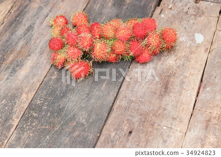 rambutan sweet fruit fresh on wood background rambutan sweet fruit fresh on wood background 34924823