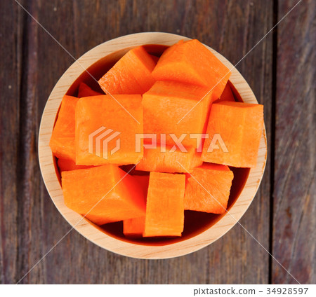 Carrot pieces on wood 34928597