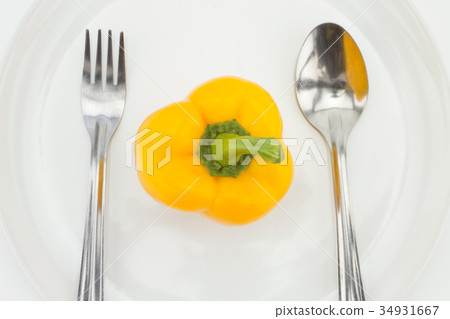diet concept. Yellow pepper on white plate. diet concept. Yellow pepper on white plate. 34931667