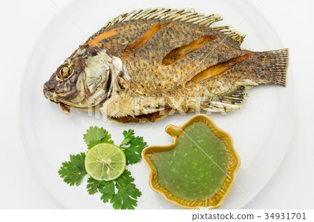 Fried Tilapia fish with spicy sauce. thai food Fried Tilapia fish with spicy sauce. thai food 34931701