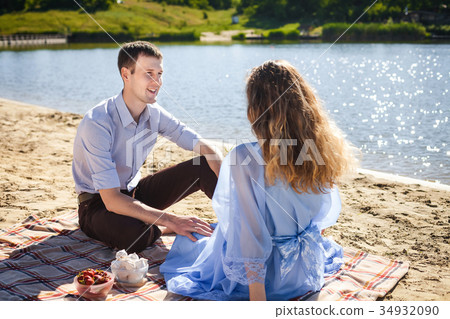 happy couple resting on beach 34932090