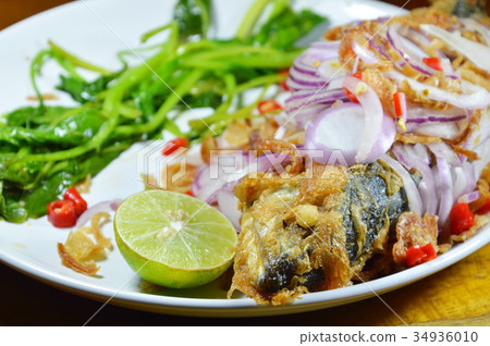 deep fried mackerel with egg salad on dish deep fried mackerel with egg salad on dish 34936010