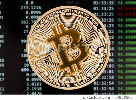 Golden Bitcoin cryptocurrency yellow coin on a Golden Bitcoin cryptocurrency yellow coin on a 34938565
