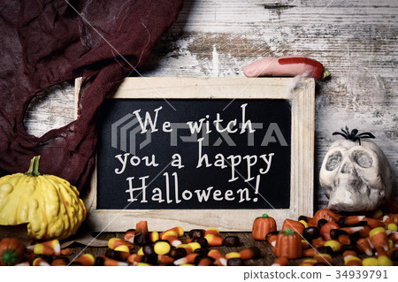 candies and text We witch you a happy Halloween 34939791