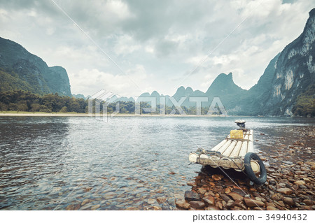 Retro toned picture of a bamboo raft on Li River. 34940432