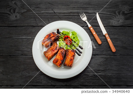 Grilled Fish Fillet over dark wooden background Grilled Fish Fillet over dark wooden background 34940640