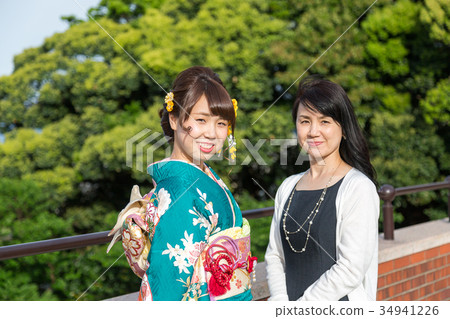Women and their families wearing kimono Women and their families wearing kimono 34941226