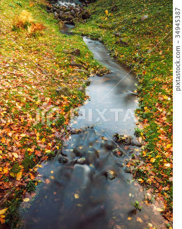 Small river in the autumn park Small river in the autumn park 34945387
