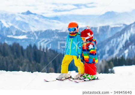 Kids winter snow sport. Children ski Family skiing Kids winter snow sport. Children ski Family skiing 34945640