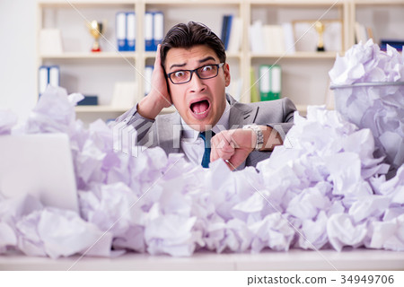 Businessman in paper recycling concept in office Businessman in paper recycling concept in office 34949706