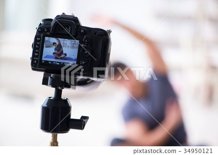 Sports and health blogger recording video in sport 34950121