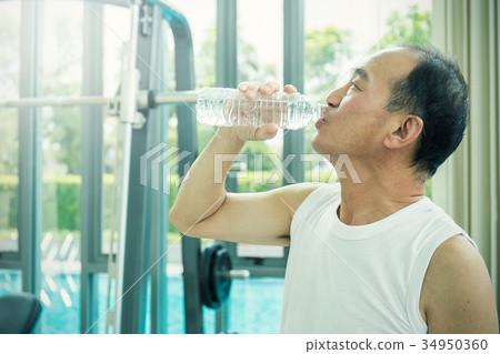 portrait of asian senior man drinking water portrait of asian senior man drinking water 34950360