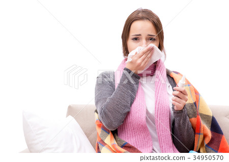 Teenager suffering from cold sitting on coach Teenager suffering from cold sitting on coach 34950570