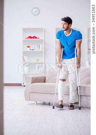 Injured young man recovering at home 34951663