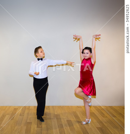 The young boy and girl posing at dance studio 34952625