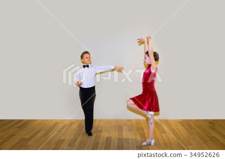 The young boy and girl posing at dance studio 34952626