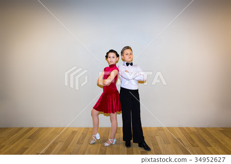 The young boy and girl posing at dance studio 34952627