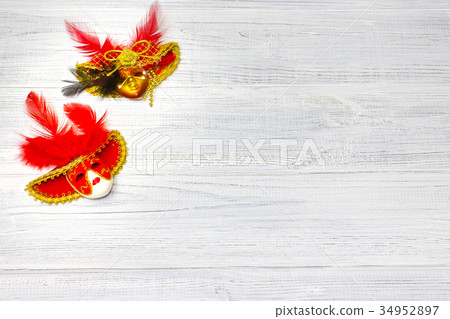 Venice masks on wooden background 34952897
