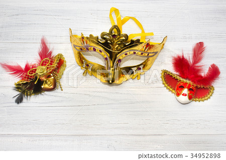 Venice masks on wooden background 34952898