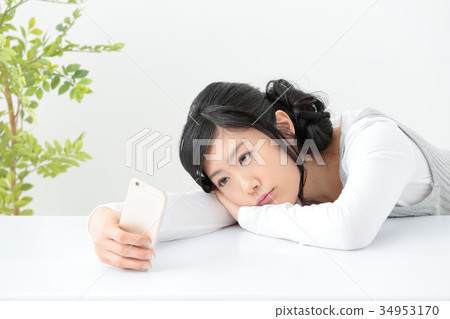 Young woman with smartphone Young woman with smartphone 34953170
